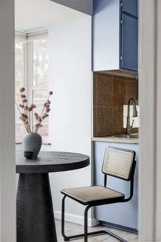 a view of dining room with furniture and window