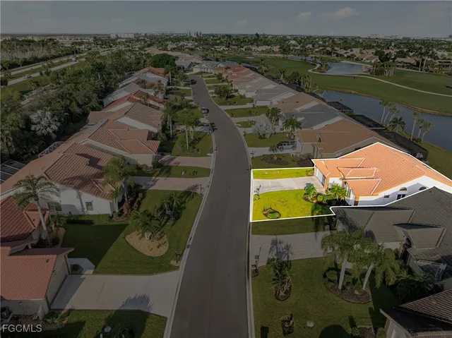 an aerial view of a house with a lake view