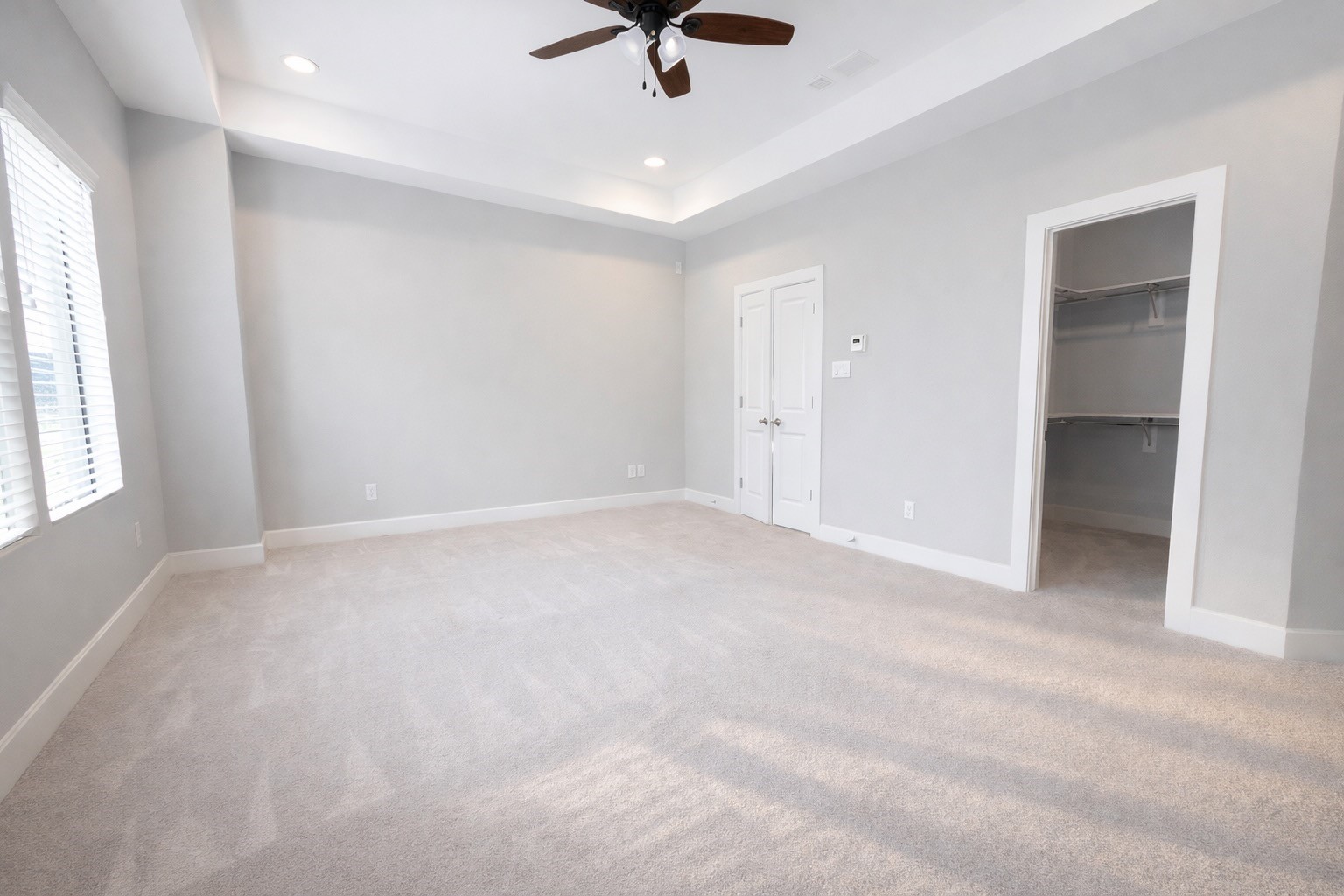 10806 Warwana Road, Unit C Houston, TX 77043 - Photo 22 of 35 an empty room with view of ceiling fan and window