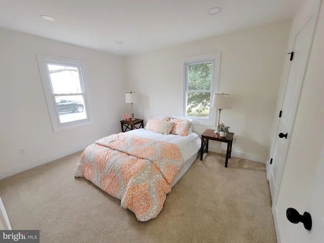 a bed room with a bed and a window