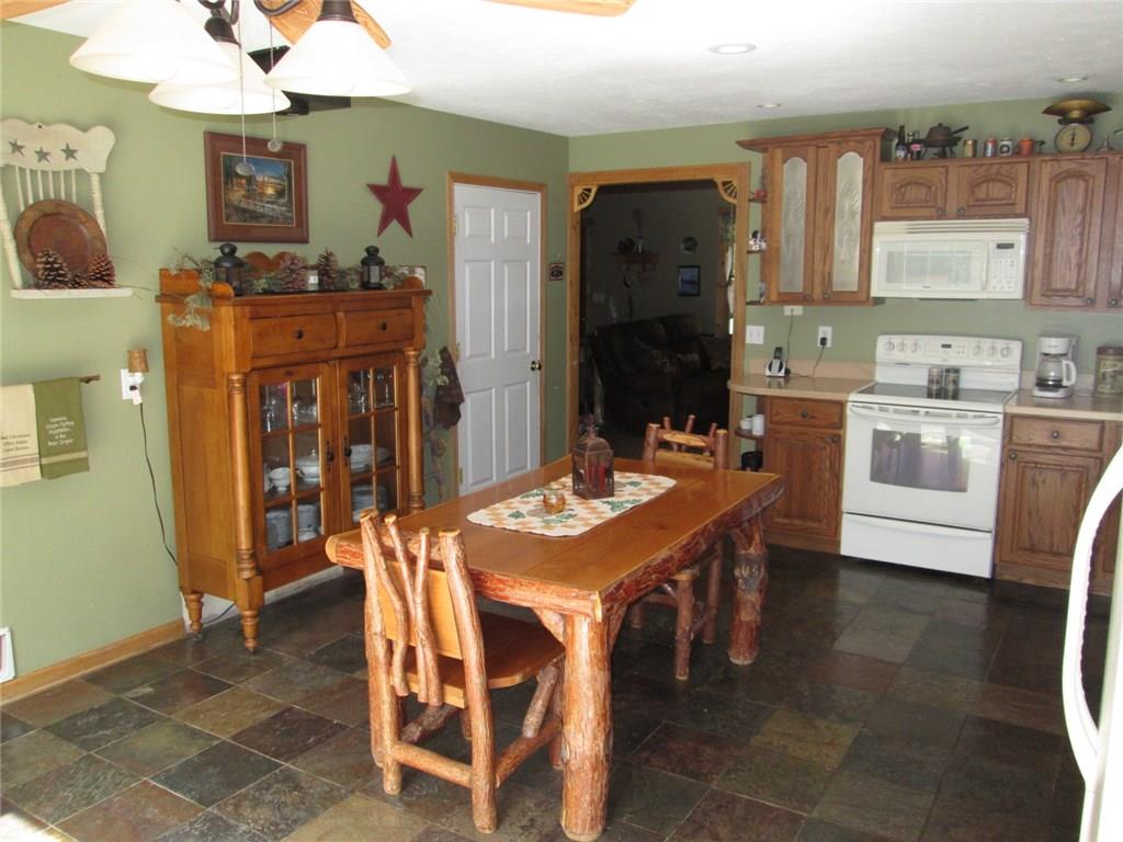260 Glynn Road Chicora, PA 16025 - Photo 10 of 20 Amazing eat in kitchen is 21x15. Beautiful Oak cabinets. Radiant floor heat, nice and warm.