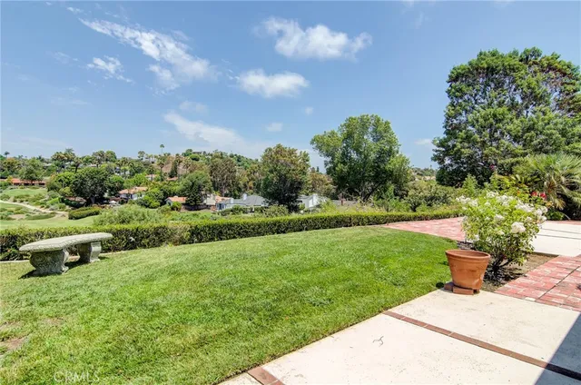 a view of a garden with houses