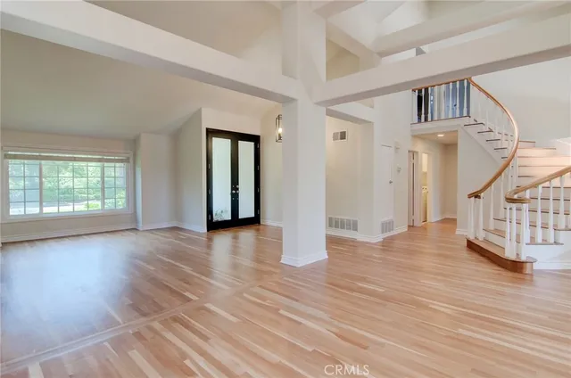 a view of an entryway with wooden floor