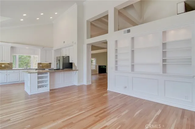 a view of kitchen with cabinets and wooden floor