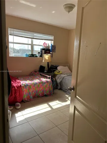 a room with window and furniture