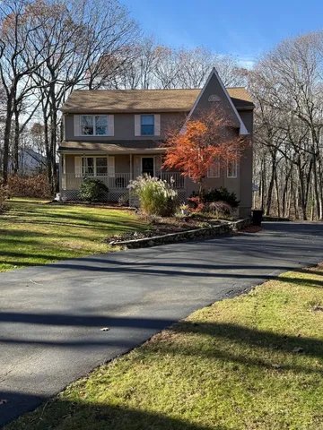 a front view of a house with a yard