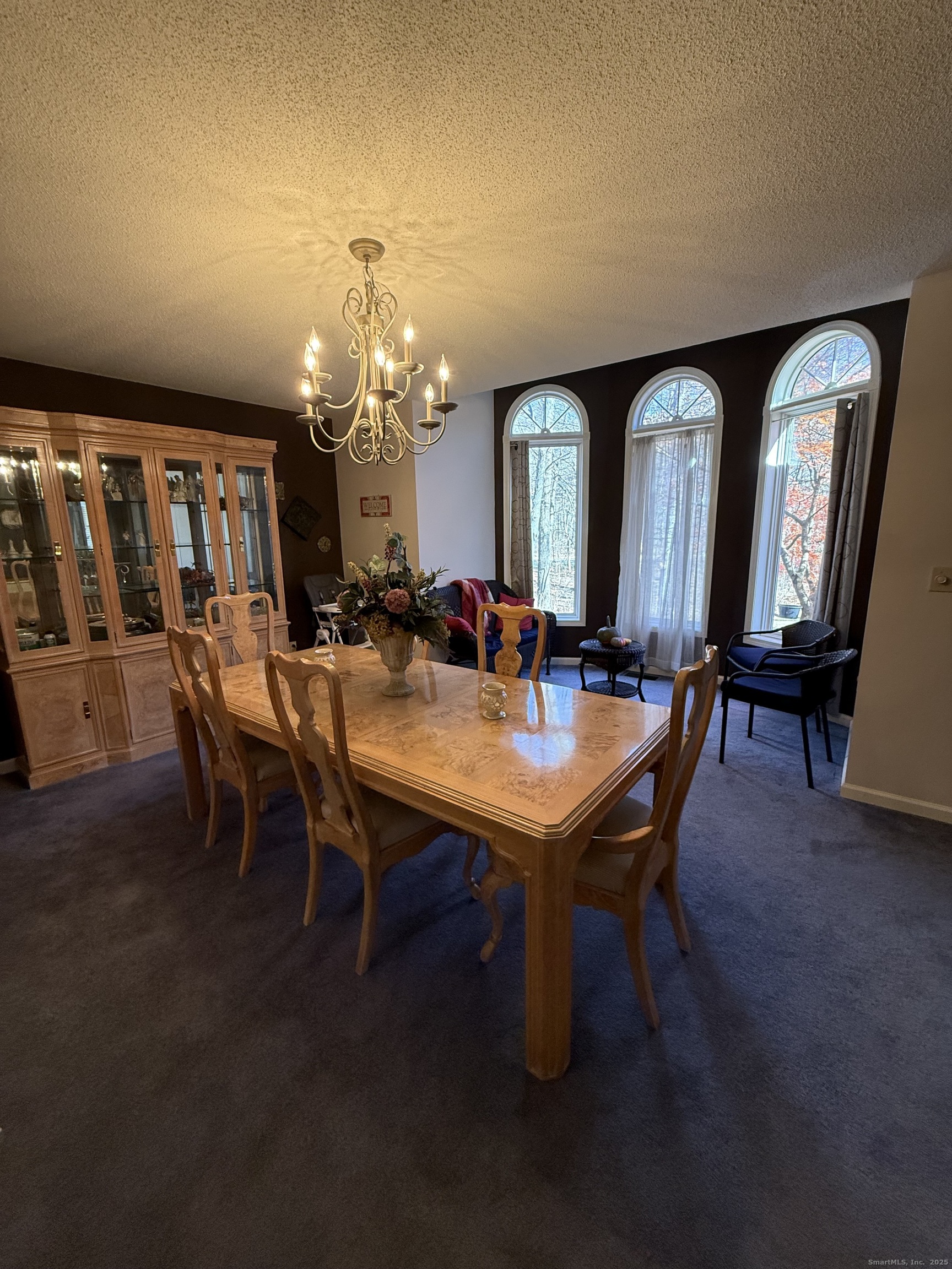 19 Wagon Trail Wolcott, CT 06716 - Photo 12 of 31 a view of a dining room with furniture and chandelier