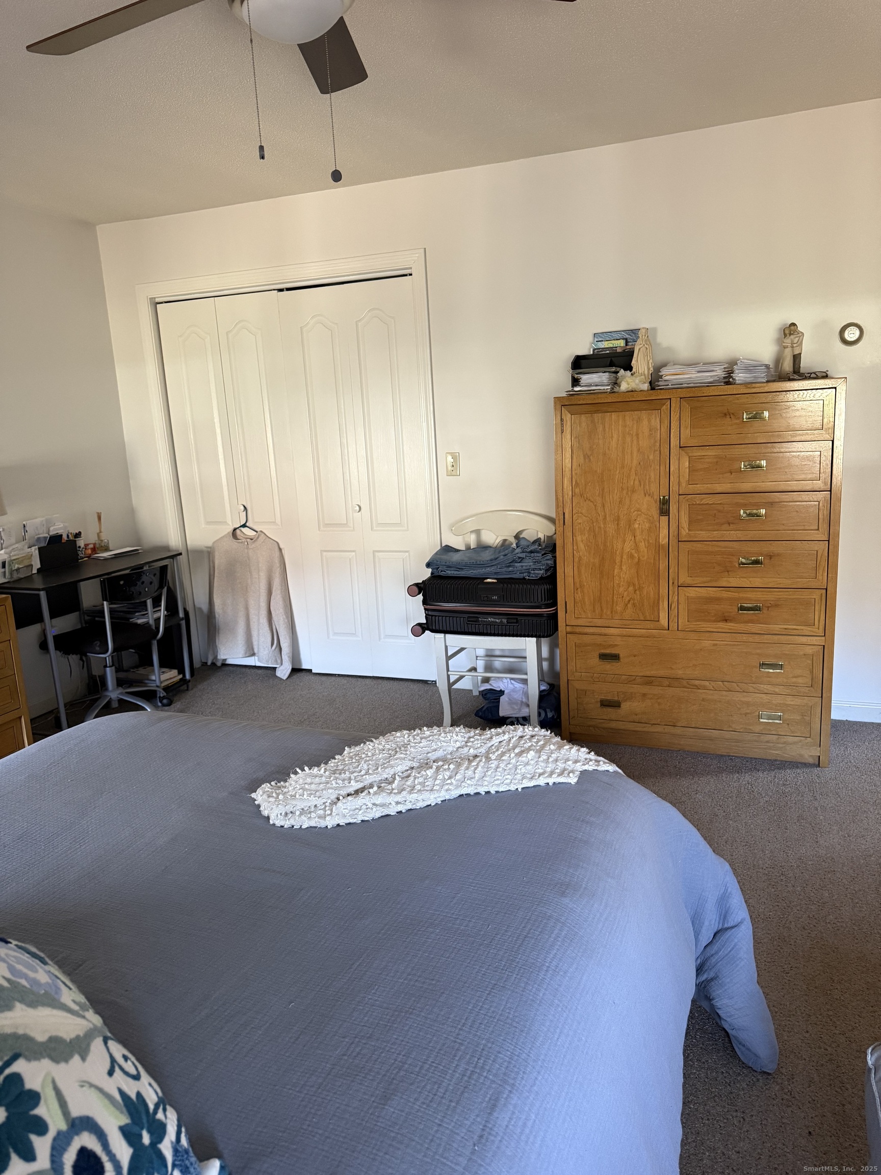 19 Wagon Trail Wolcott, CT 06716 - Photo 19 of 31 a bedroom with a bed and a mirror