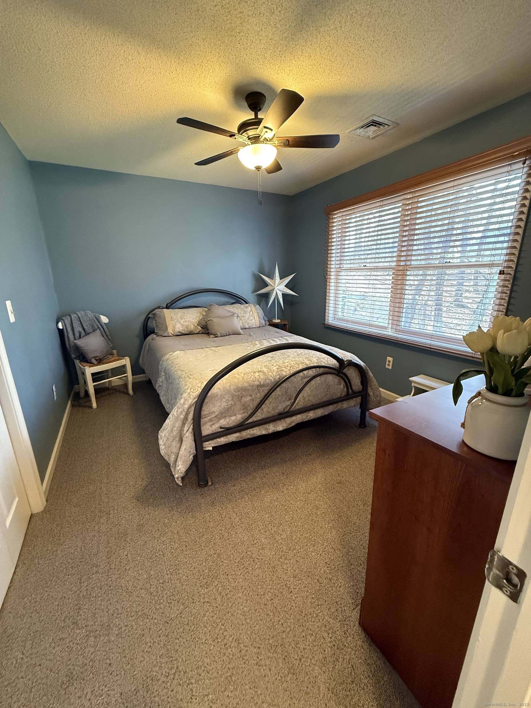 19 Wagon Trail Wolcott, CT 06716 - Photo 24 of 31 a bed room with a bed and a chair