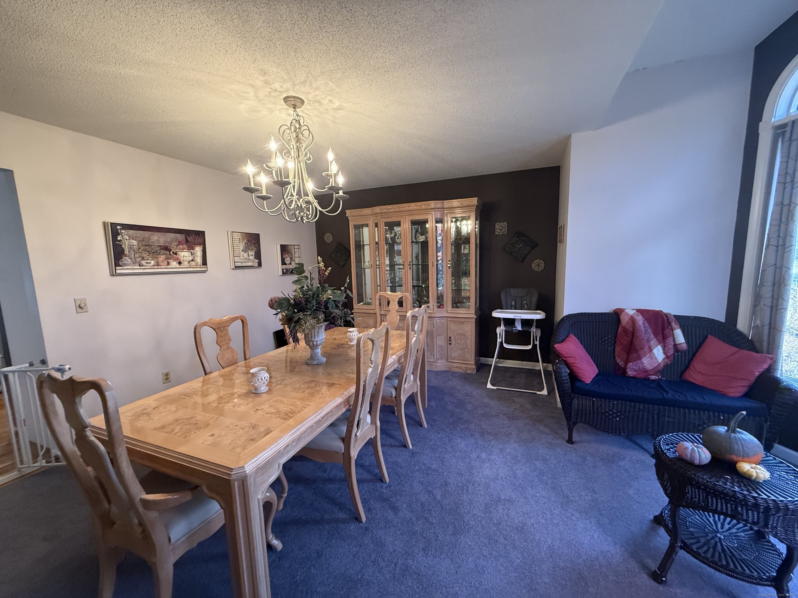 19 Wagon Trail Wolcott, CT 06716 - Photo 10 of 31 a view of a dining room with furniture and chandelier