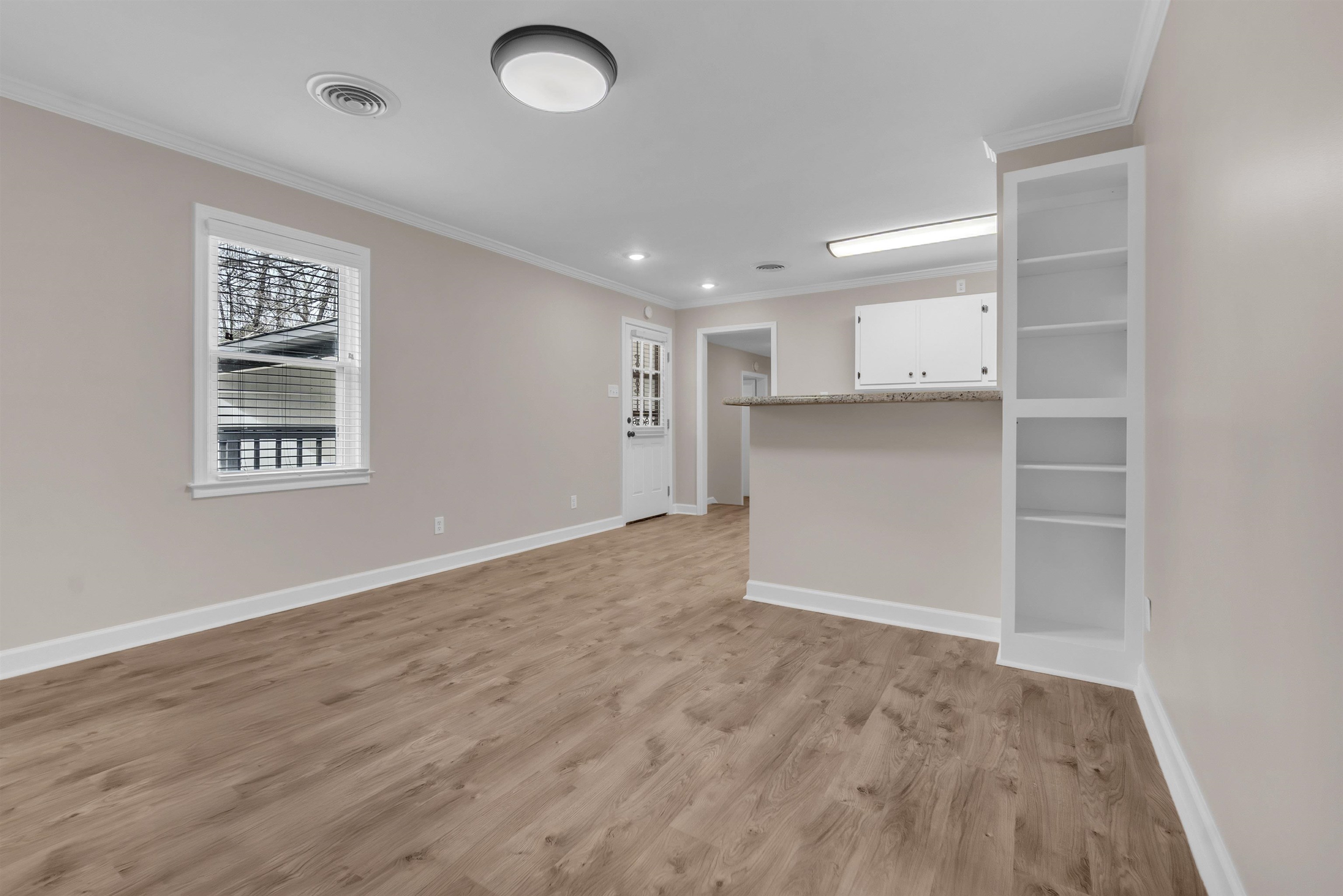 1371 Phillips Road Memphis, TN 38134 - Photo 15 of 35 Spare room featuring light wood-style floors and ornamental molding