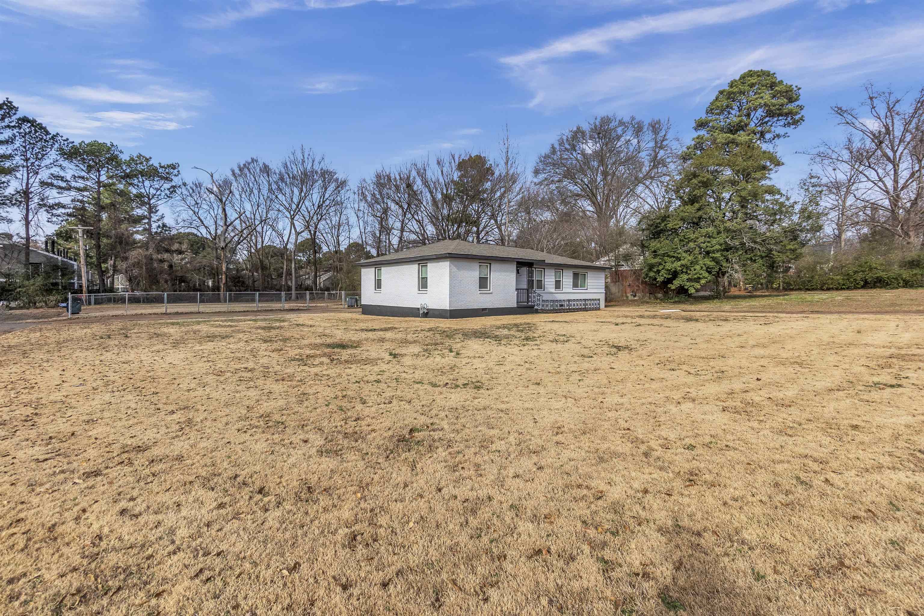 1371 Phillips Road Memphis, TN 38134 - Photo 2 of 35 Back of property with view of scattered trees