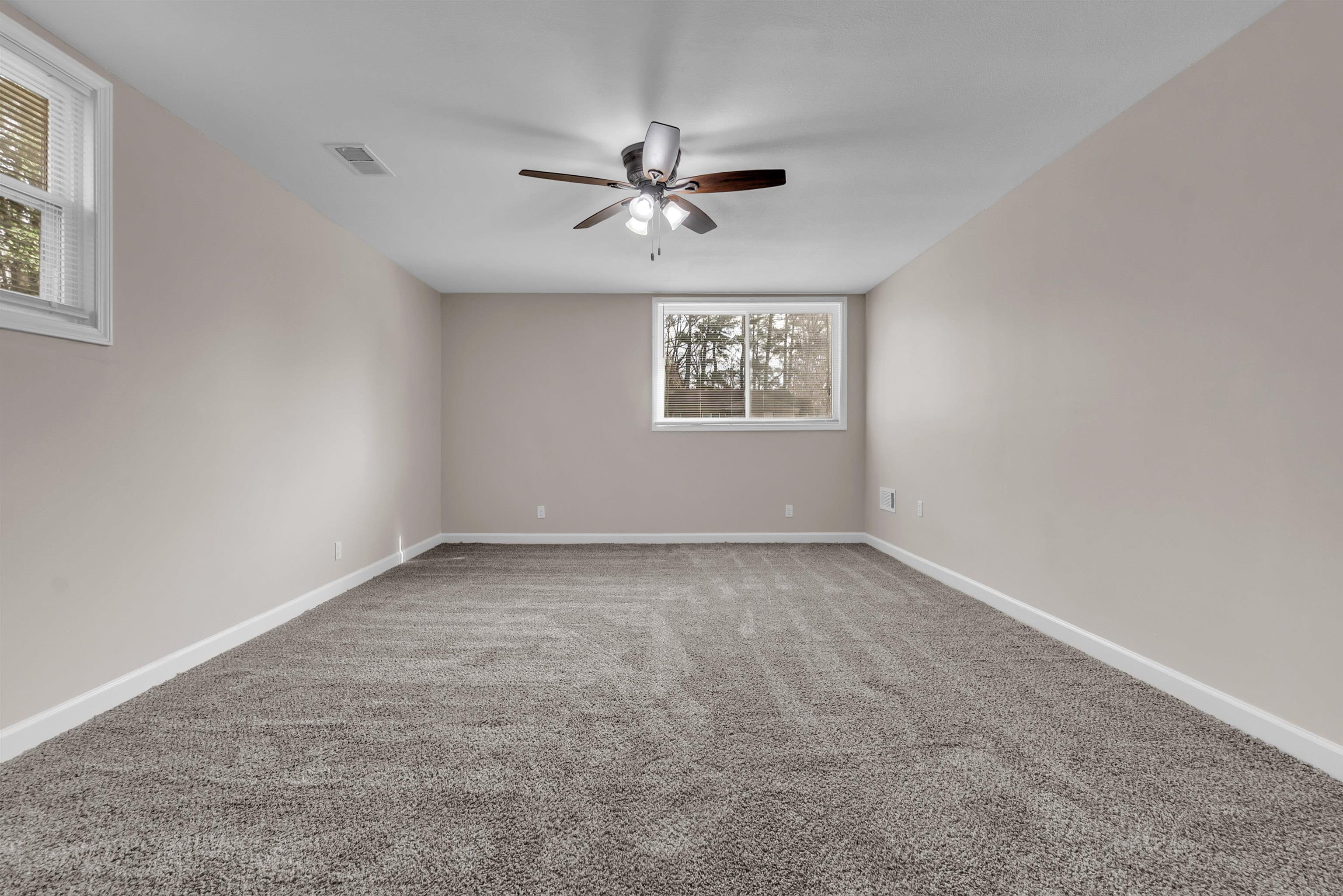 1371 Phillips Road Memphis, TN 38134 - Photo 22 of 35 Unfurnished room featuring light carpet and baseboards