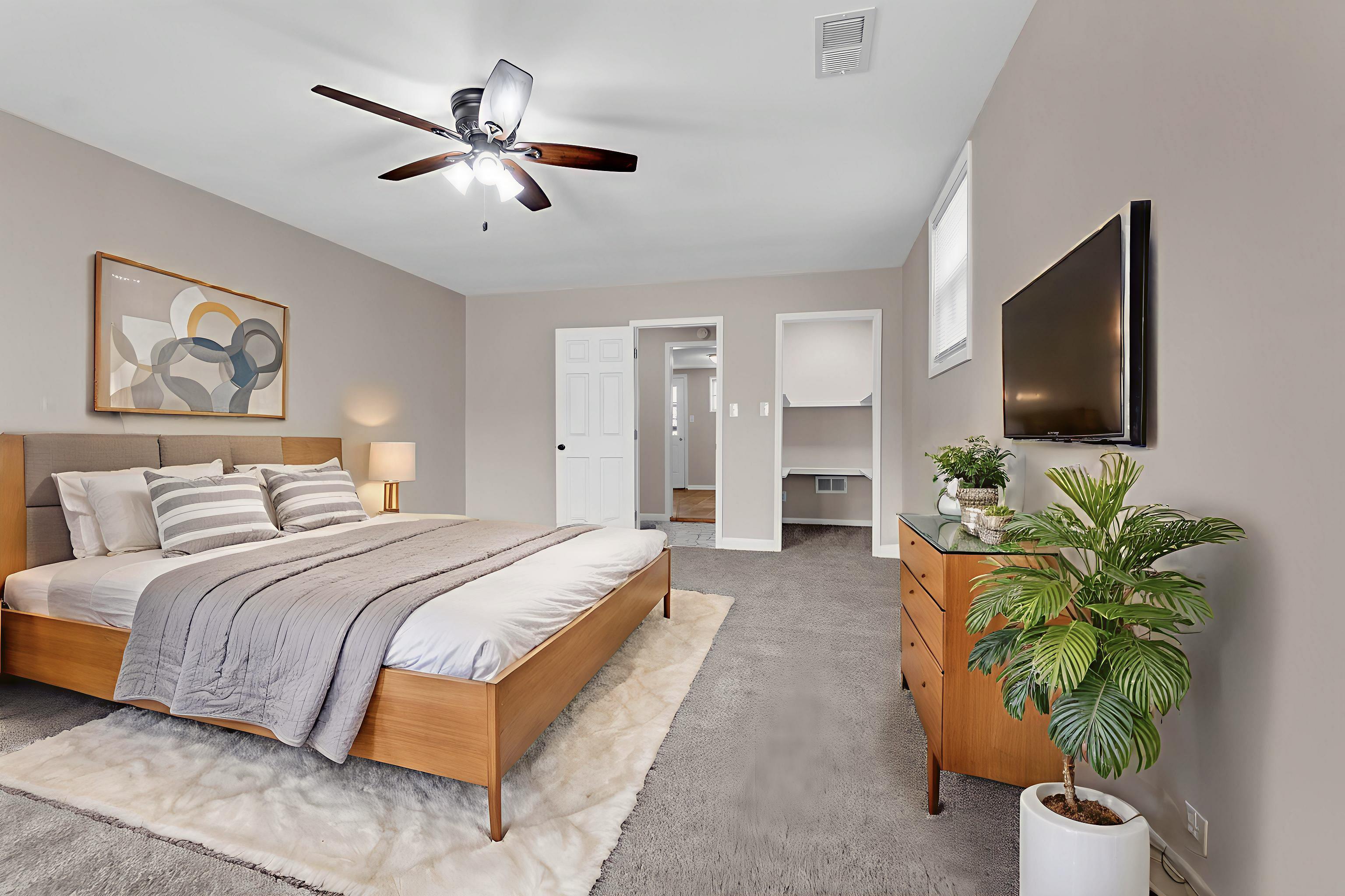 1371 Phillips Road Memphis, TN 38134 - Photo 25 of 35 Bedroom featuring light colored carpet, ceiling fan, and a spacious closet