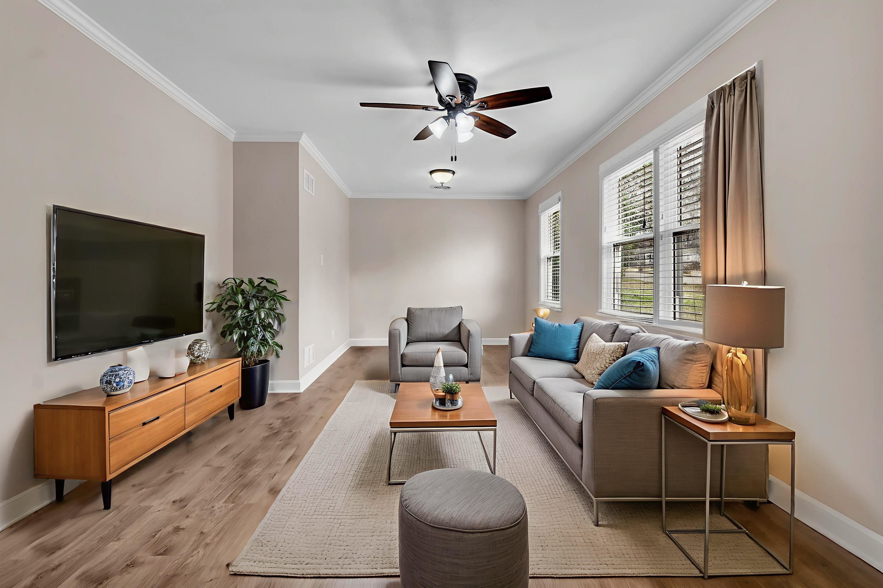 1371 Phillips Road Memphis, TN 38134 - Photo 8 of 35 Living area with ornamental molding, ceiling fan, and light wood-type flooring