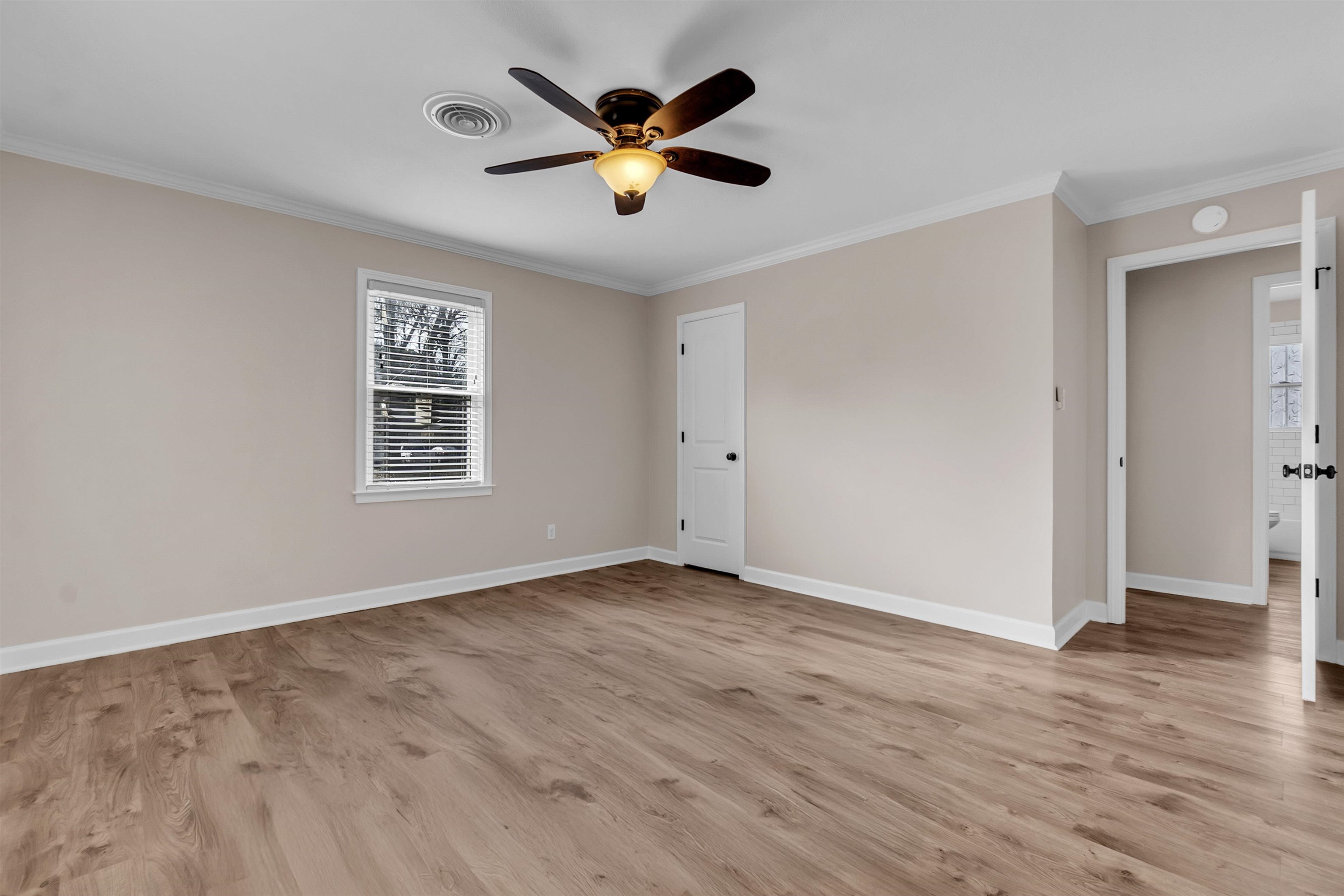 1371 Phillips Road Memphis, TN 38134 - Photo 10 of 35 Unfurnished room featuring ornamental molding, light wood-style flooring, and ceiling fan