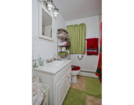 28 Barton Street Springfield, MA 01104 - Photo 15 of 26 a bathroom with a sink and a mirror