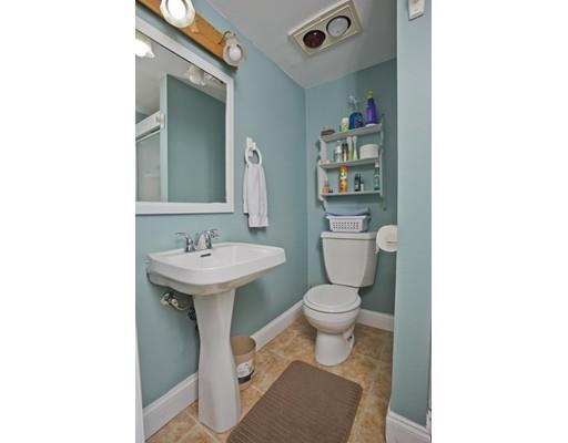 28 Barton Street Springfield, MA 01104 - Photo 21 of 26 a bathroom with a sink toilet and a mirror