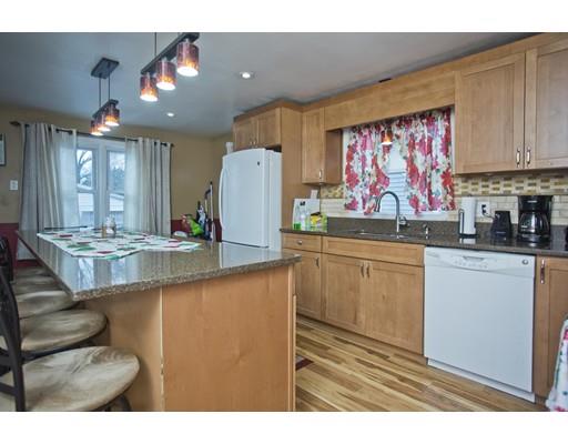 28 Barton Street Springfield, MA 01104 - Photo 5 of 26 a kitchen with stainless steel appliances granite countertop a sink and a microwave