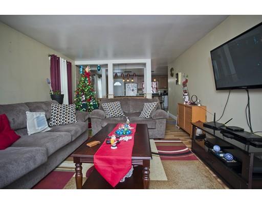 28 Barton Street Springfield, MA 01104 - Photo 8 of 26 a living room with furniture and a flat screen tv