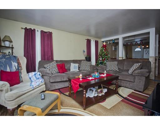 28 Barton Street Springfield, MA 01104 - Photo 9 of 26 a living room with furniture and a couch