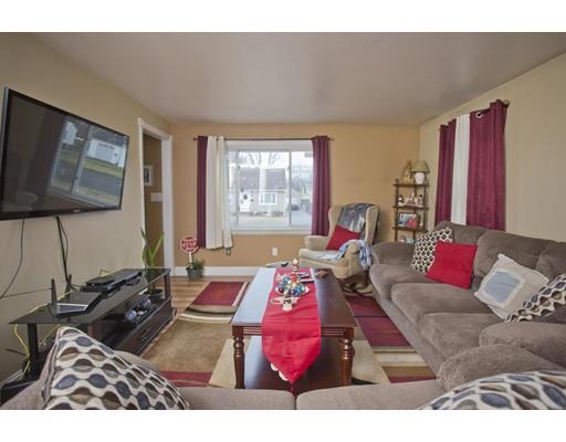 28 Barton Street Springfield, MA 01104 - Photo 10 of 26 a living room with furniture and a flat screen tv