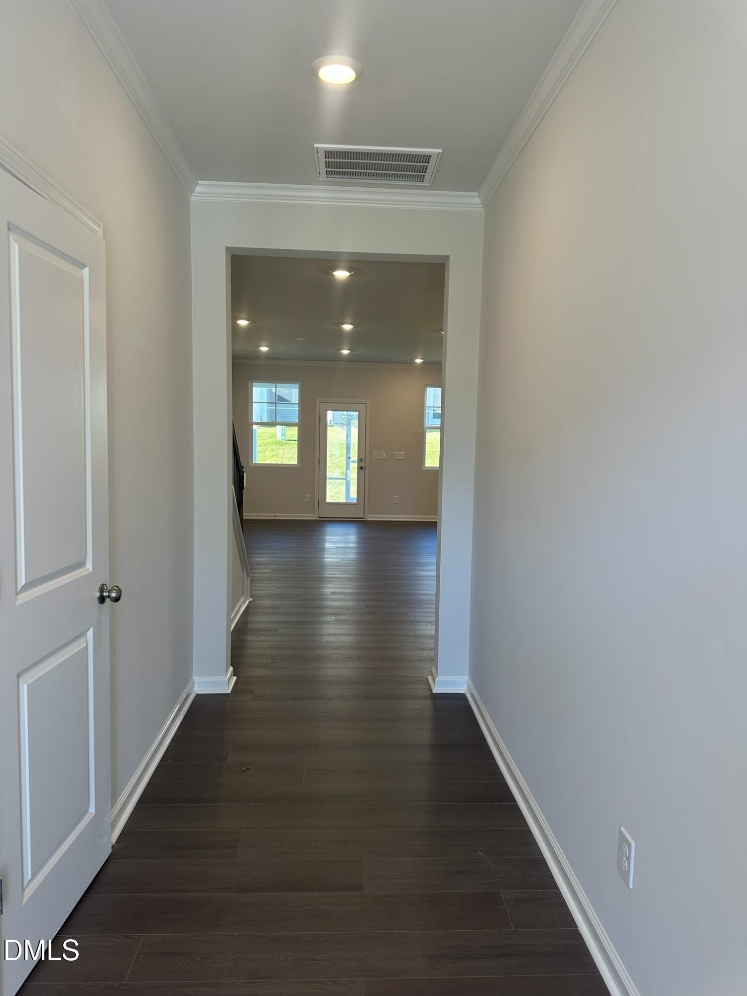 507 Hester Road Durham, NC 27703 - Photo 2 of 33 a view of a hallway with wooden floor and windows