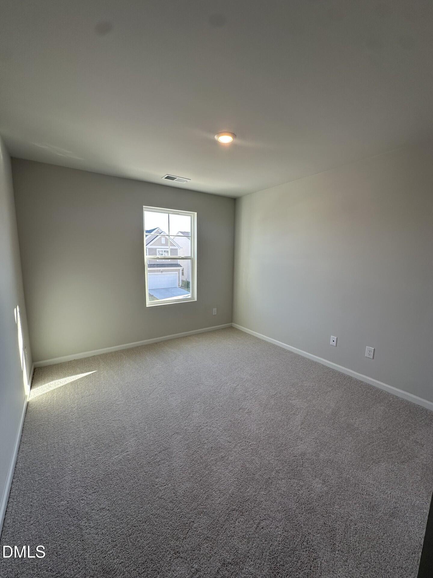 507 Hester Road Durham, NC 27703 - Photo 9 of 33 an empty room with a window