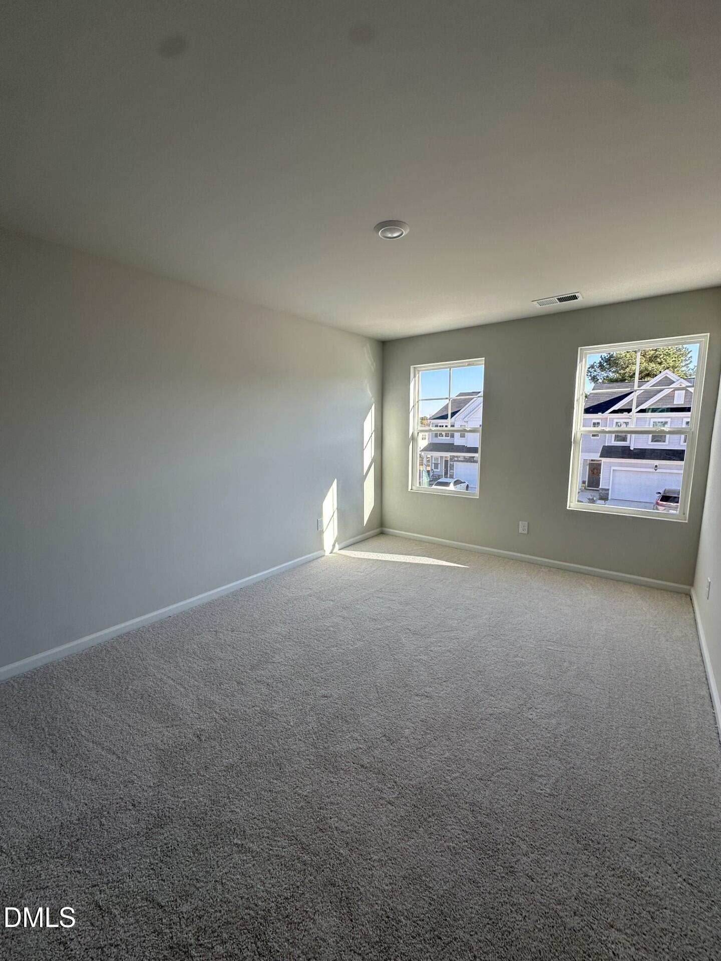 507 Hester Road Durham, NC 27703 - Photo 10 of 33 an empty room with windows
