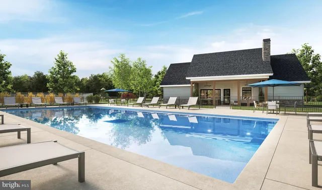 a view of house with swimming pool outdoor seating