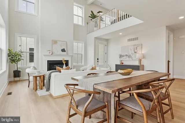a view of a dining room with furniture and a fireplace