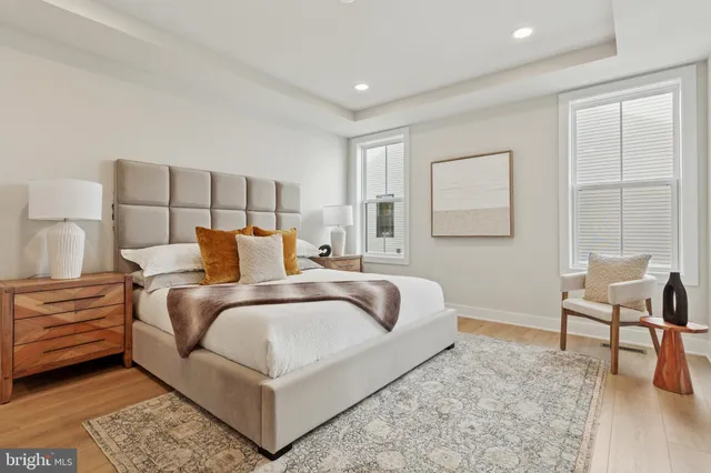 a bedroom with a bed and a couch