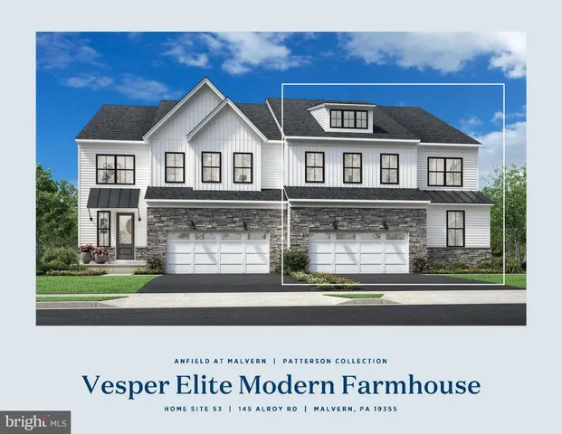 a view of a brick house with a small yard