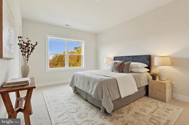 a bedroom with a bed and window