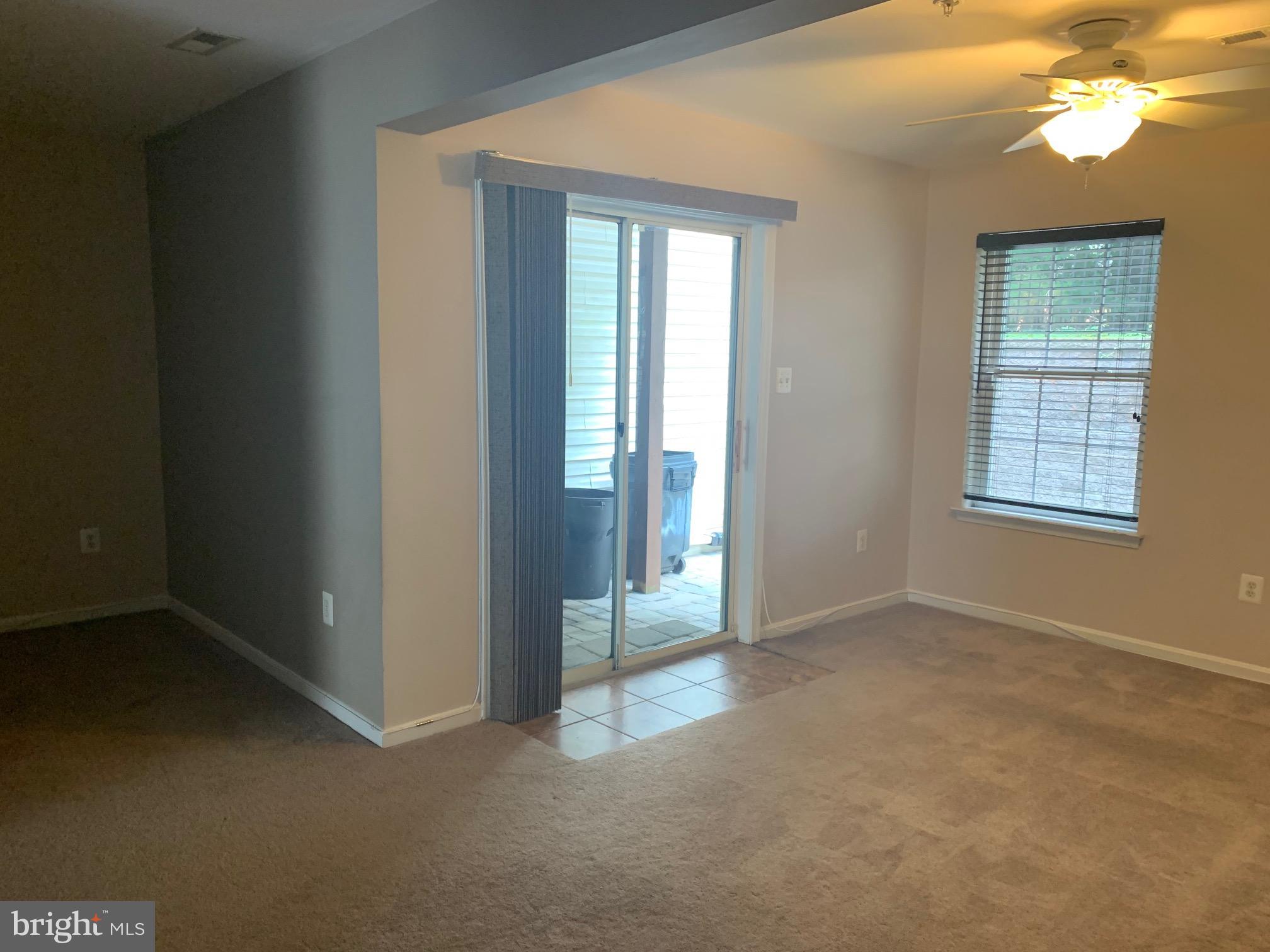 210 Tilden Way Edgewater, MD 21037 - Photo 23 of 34 Entry level family room with sliders to patio