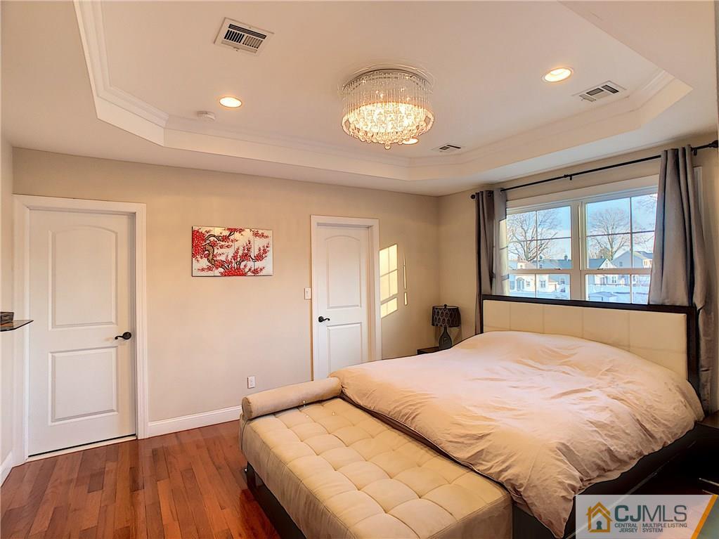 724 Palisade Road Union, NJ 07083 - Photo 11 of 20 a bedroom with a large bed and a large window