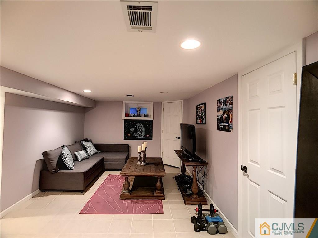 724 Palisade Road Union, NJ 07083 - Photo 15 of 20 a living room with furniture and a flat screen tv