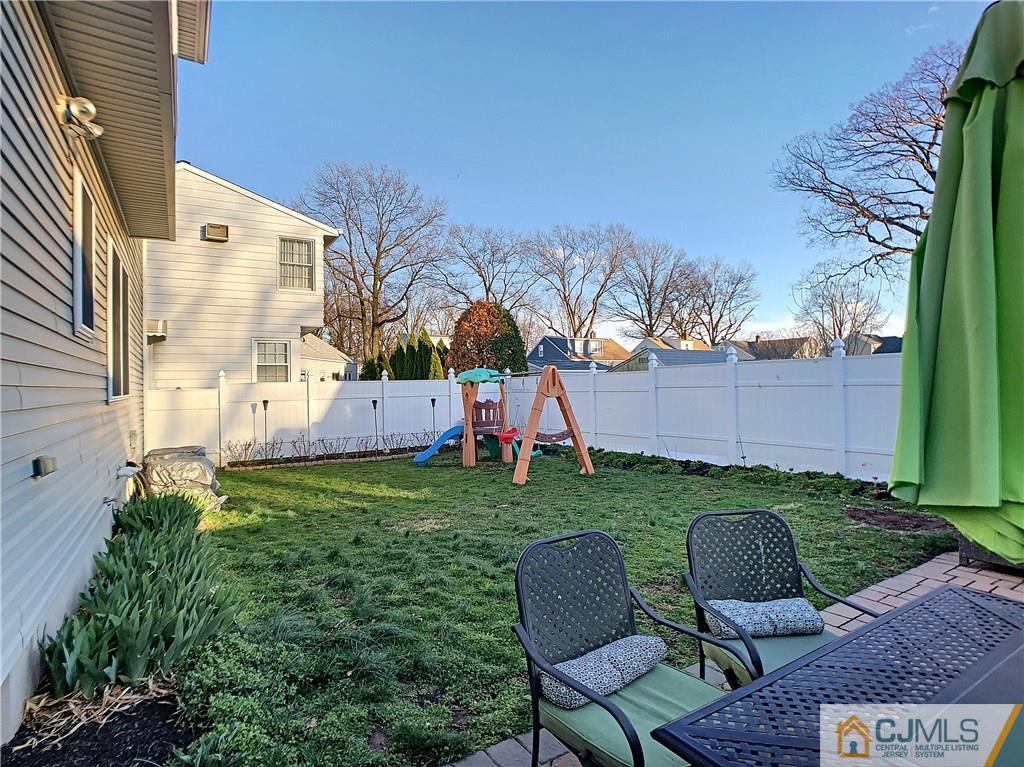 724 Palisade Road Union, NJ 07083 - Photo 19 of 20 a backyard of a house with table and chairs
