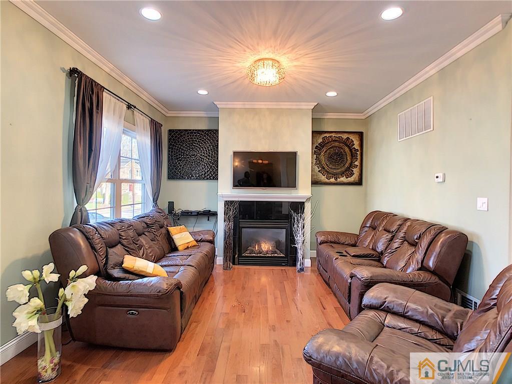 724 Palisade Road Union, NJ 07083 - Photo 3 of 20 a living room with furniture fireplace and a flat screen tv