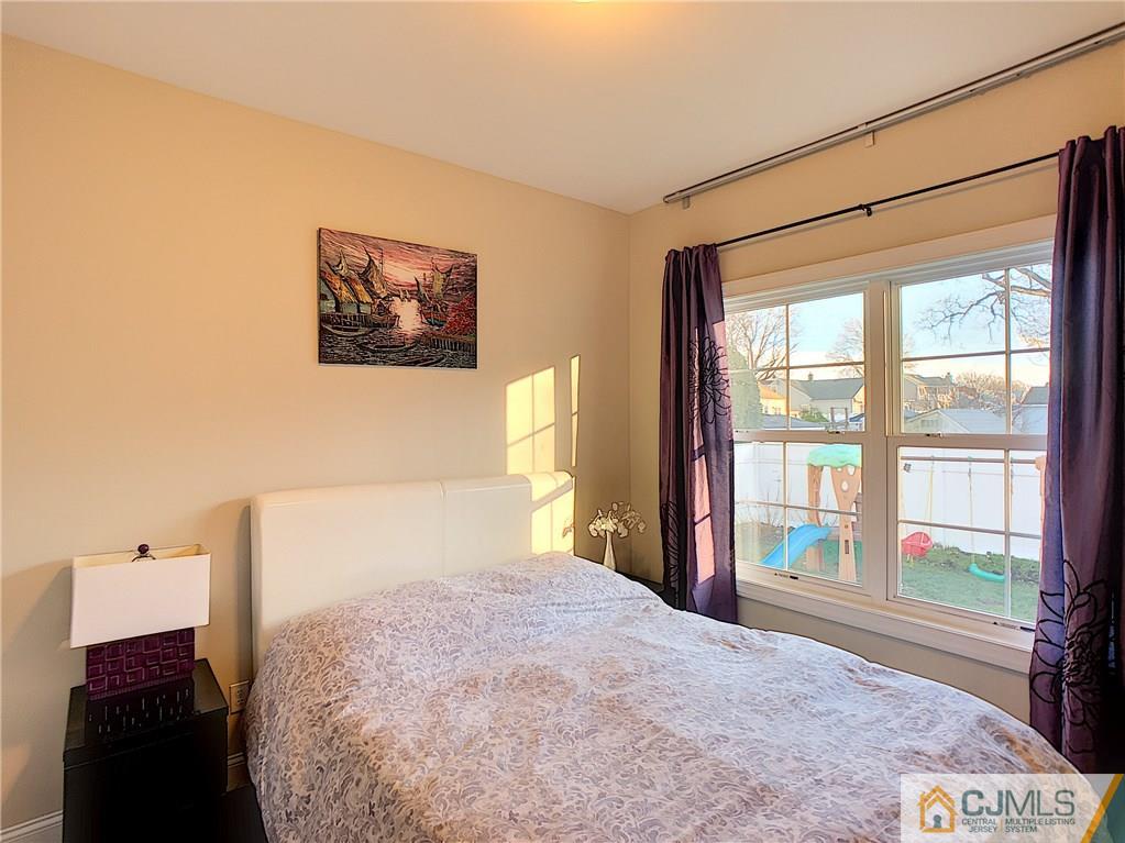 724 Palisade Road Union, NJ 07083 - Photo 7 of 20 a bedroom with a bed and a window