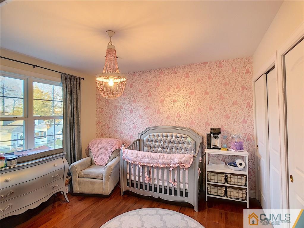 724 Palisade Road Union, NJ 07083 - Photo 8 of 20 a bedroom with furniture and a window