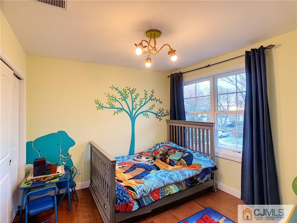 724 Palisade Road Union, NJ 07083 - Photo 9 of 20 a bedroom with furniture and a window