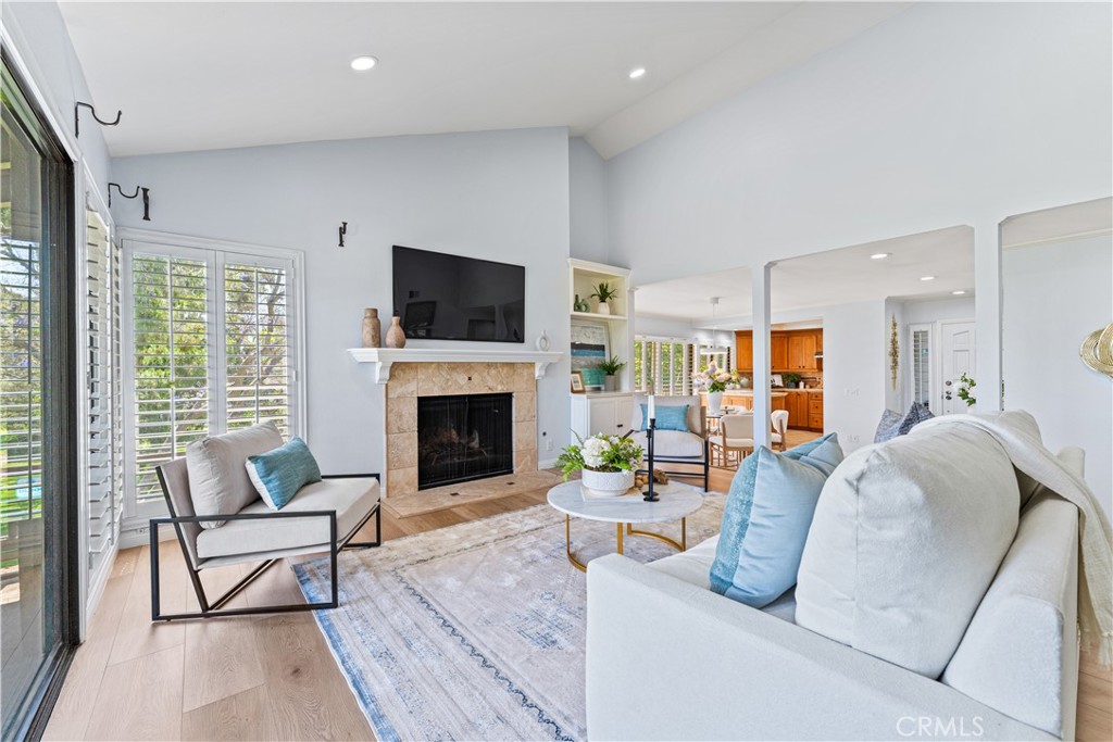 17 Verde Irvine, CA 92612 - Photo 19 of 52 a living room with furniture fireplace and a flat screen tv