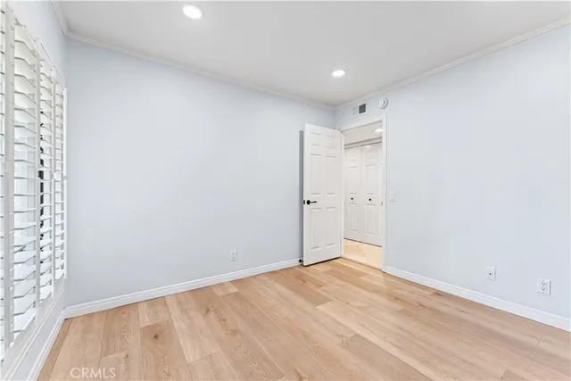 a bathroom with a granite countertop sink and a toilet