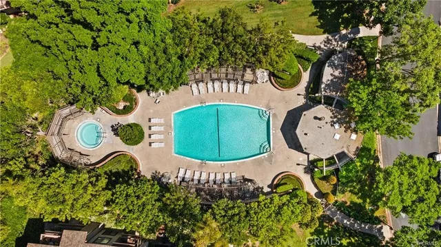 a view of a swimming pool with a patio