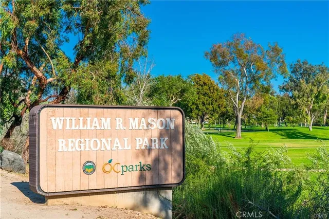 a view of a swimming pool with a yard