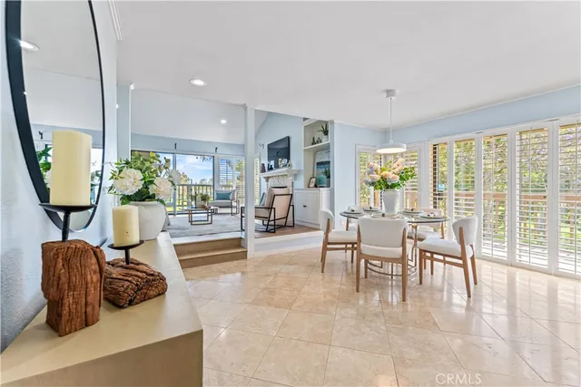 a room with round mirror and cabinets