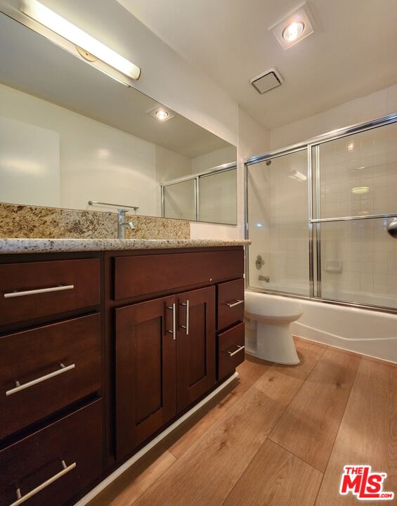 832 3rd Street, Unit 203 Santa Monica, CA 90403 - Photo 14 of 16 a bathroom with a granite countertop sink toilet and shower