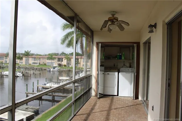 a very nice looking room with a large window and a glass door