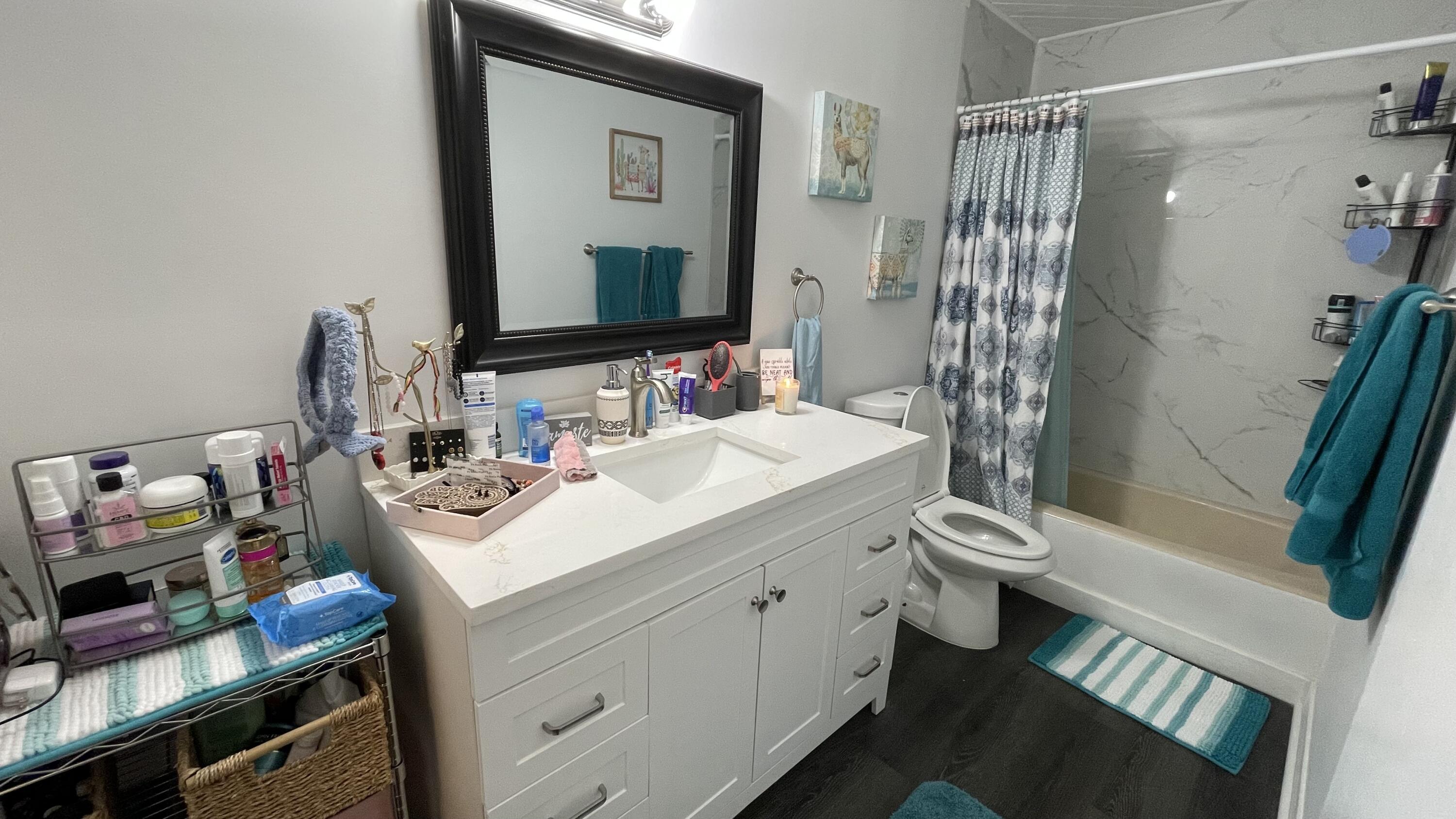 91790 Overseas Highway, Unit BACK Tavernier, FL 33070 - Photo 8 of 13 a bathroom with a sink toilet and shower